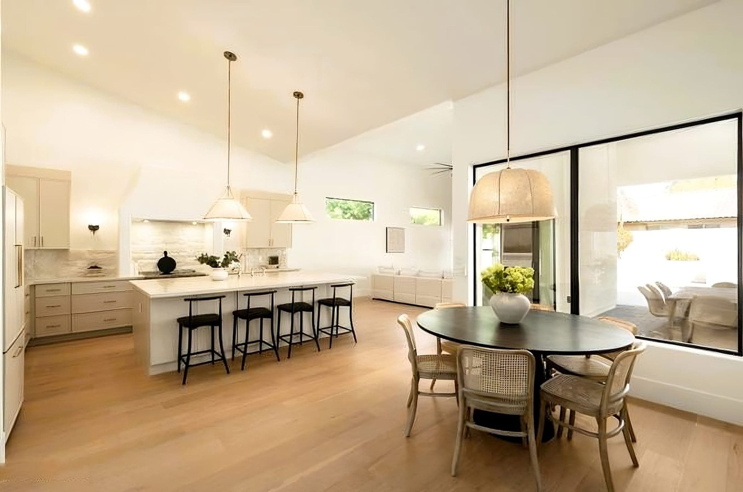 Gainey Ranch contemporary kitchen with quartzite island and integrated appliances