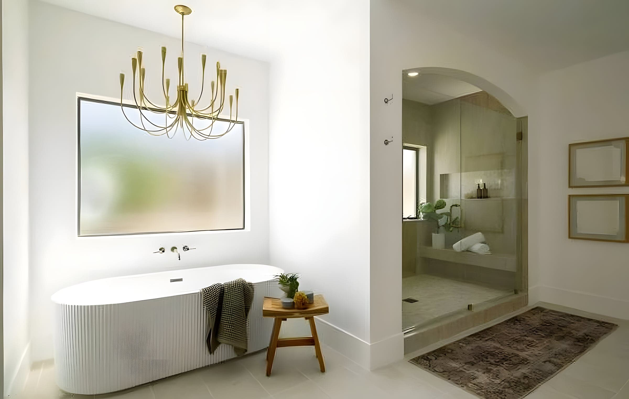 This primary bath balances luxury and function — heated floors, a deep soaking tub, and a zero-threshold shower entry.
