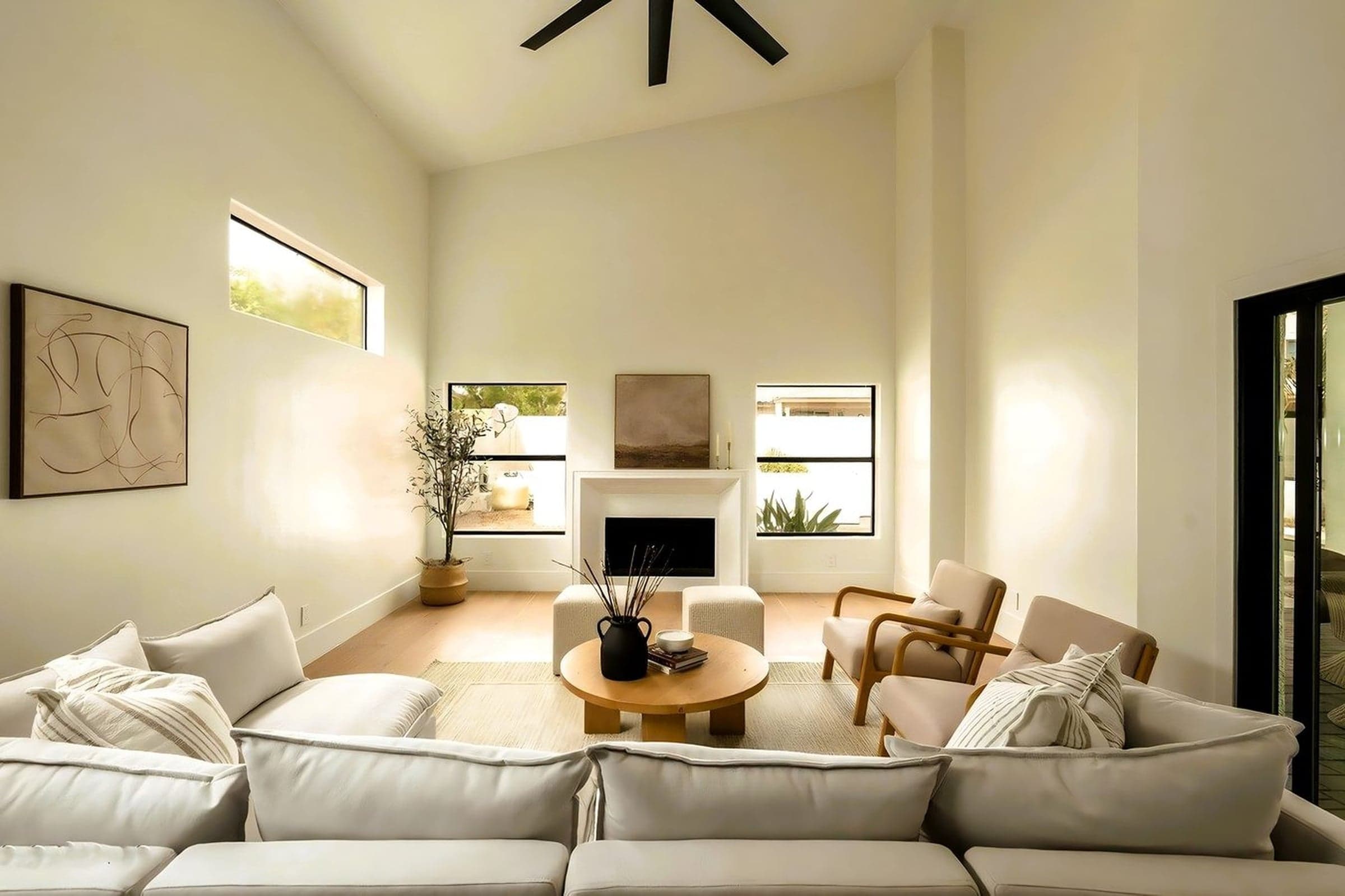McCormick Ranch family room with vaulted ceiling, fireplace, and abstract art