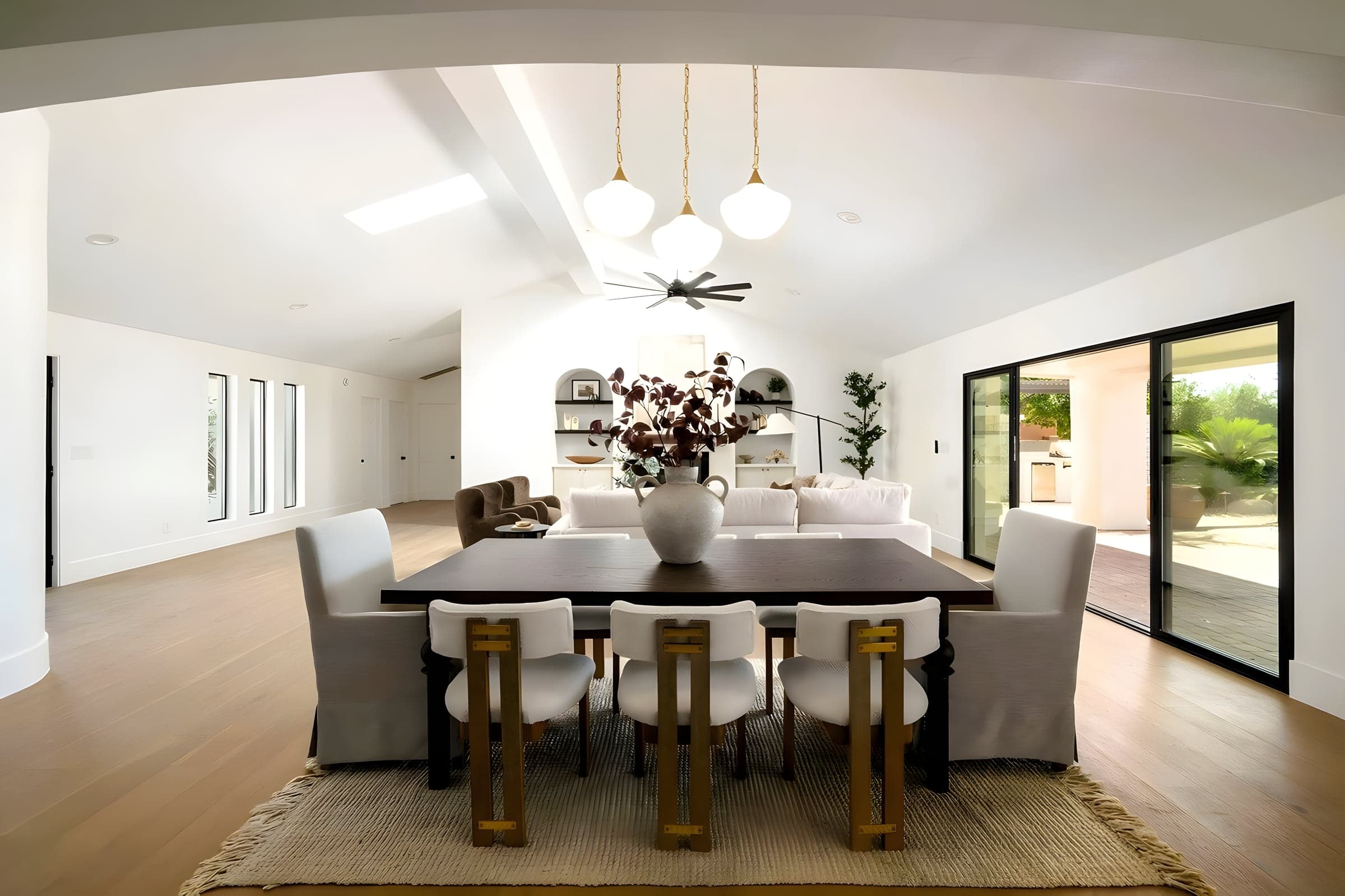 The dining room opens fully to the covered patio — a design that makes the most of 300+ days of Arizona sunshine.