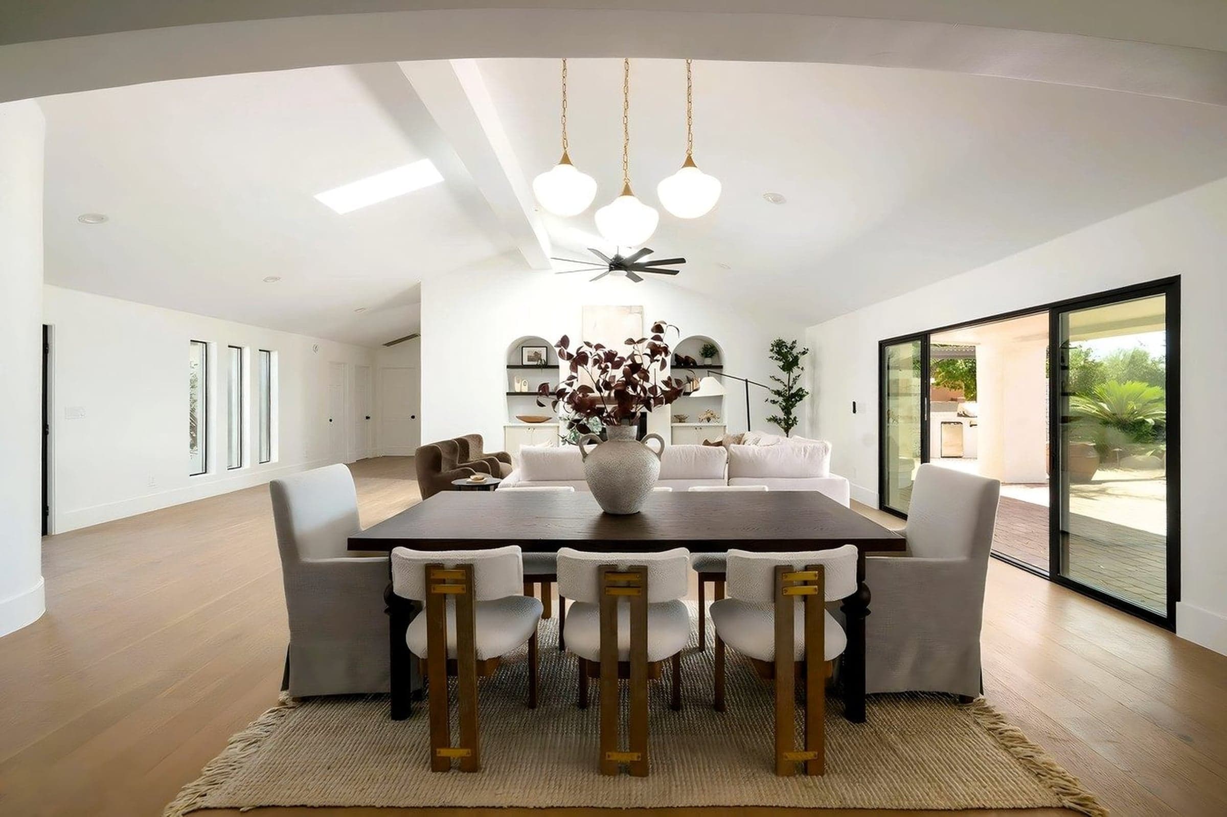 The great room transitions seamlessly into the dining area — perfect for hosting with Pinnacle Peak as the backdrop.