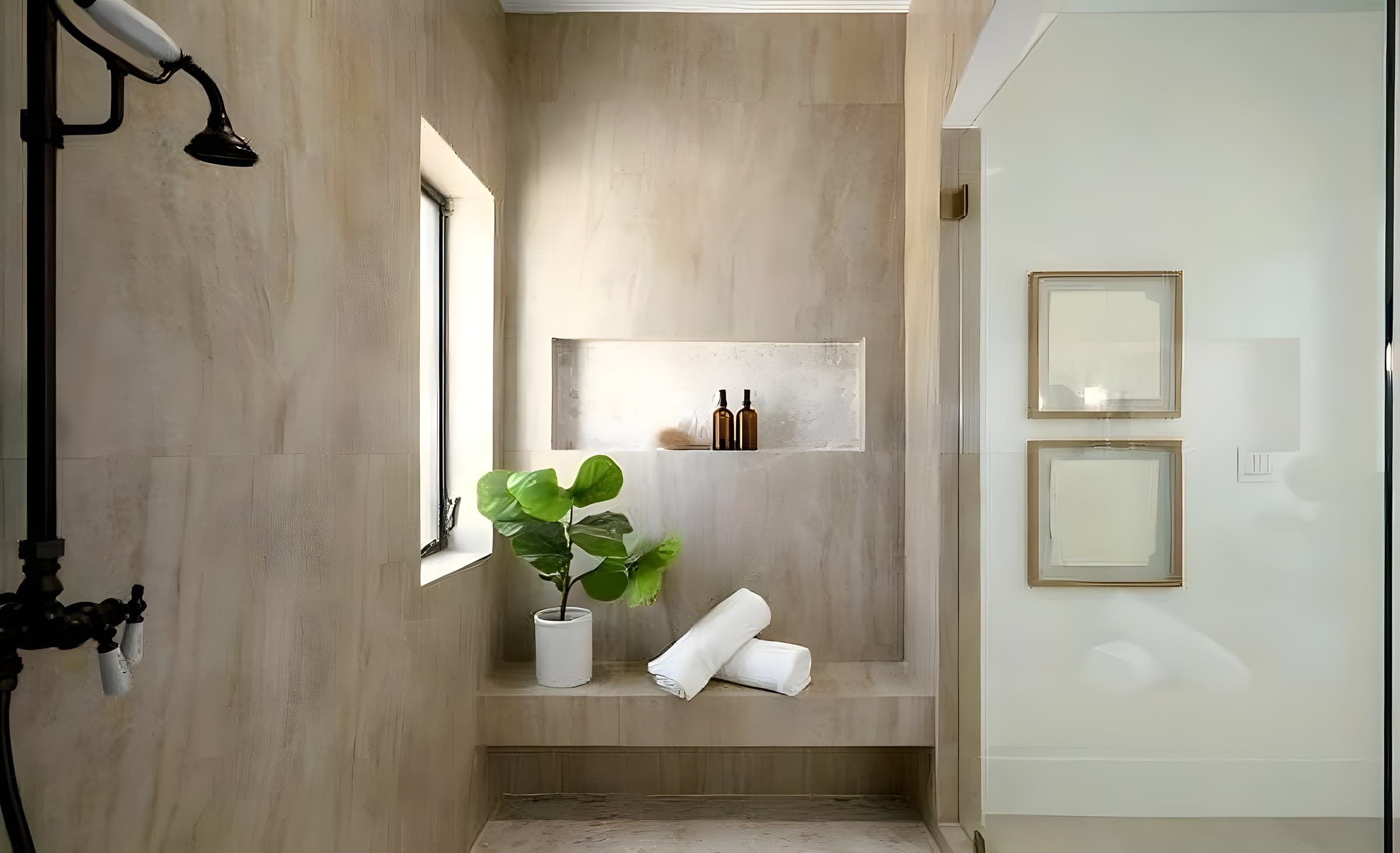 Master bath shower with travertine walls, built-in niche, and natural light