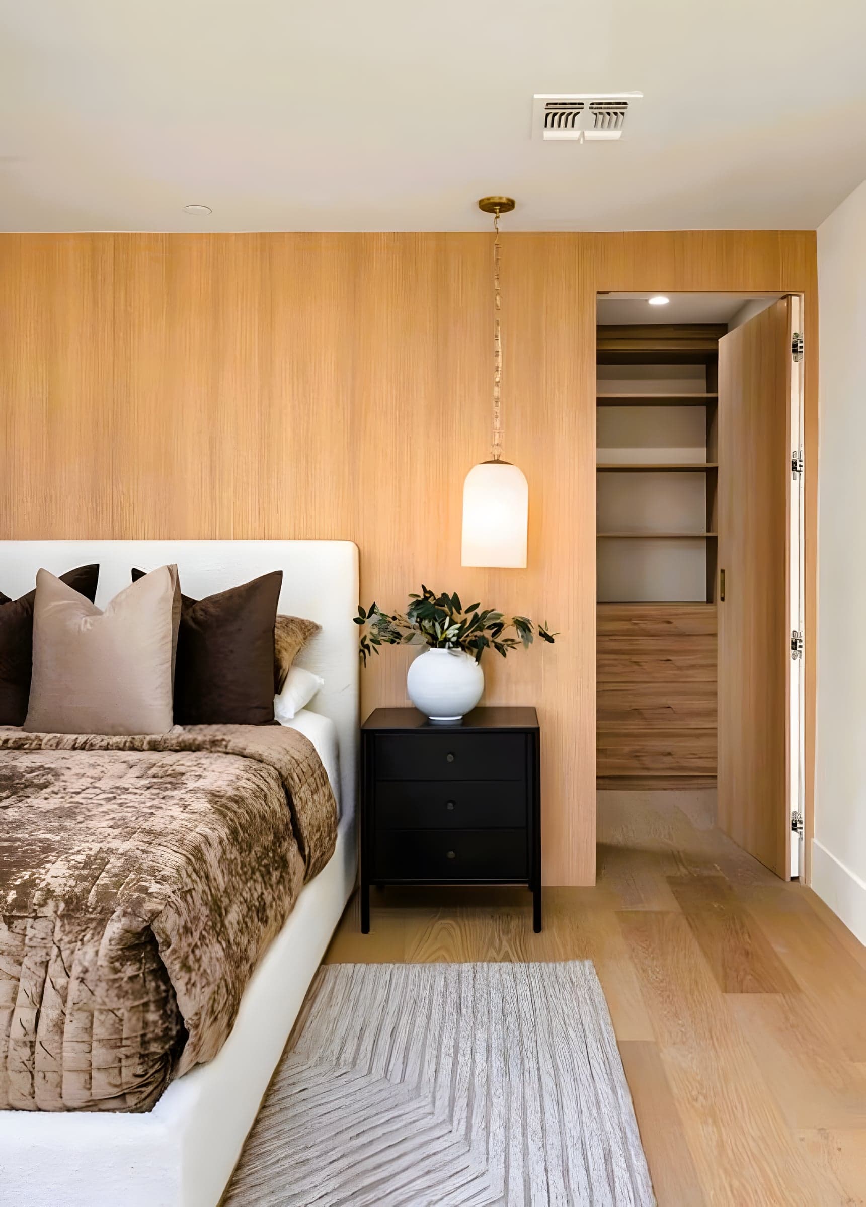 Guest Suite with Wood-Paneled Wall