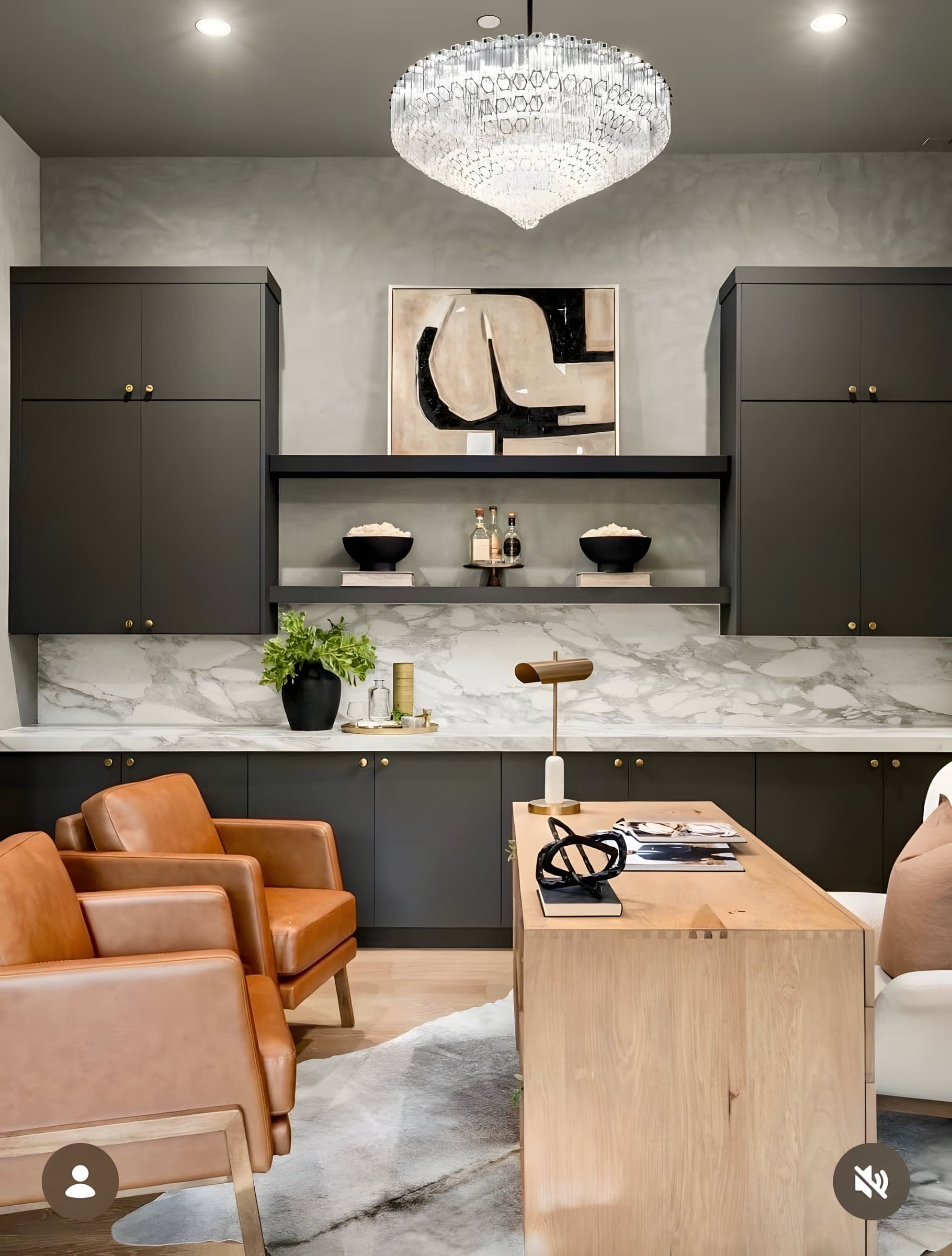 This dual-purpose room pairs a marble wet bar with a live-edge desk — sophisticated enough for clients, comfortable enough for late nights.