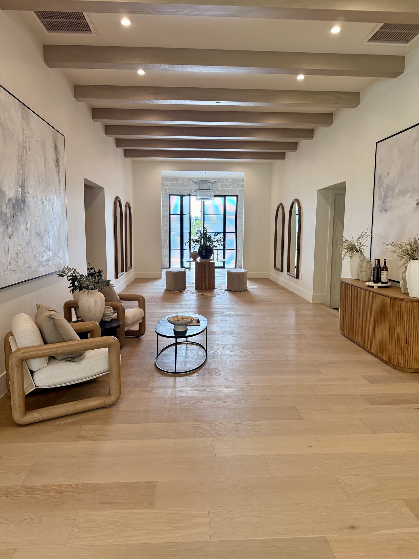 Paradise Valley grand entry foyer with exposed beams and curated art