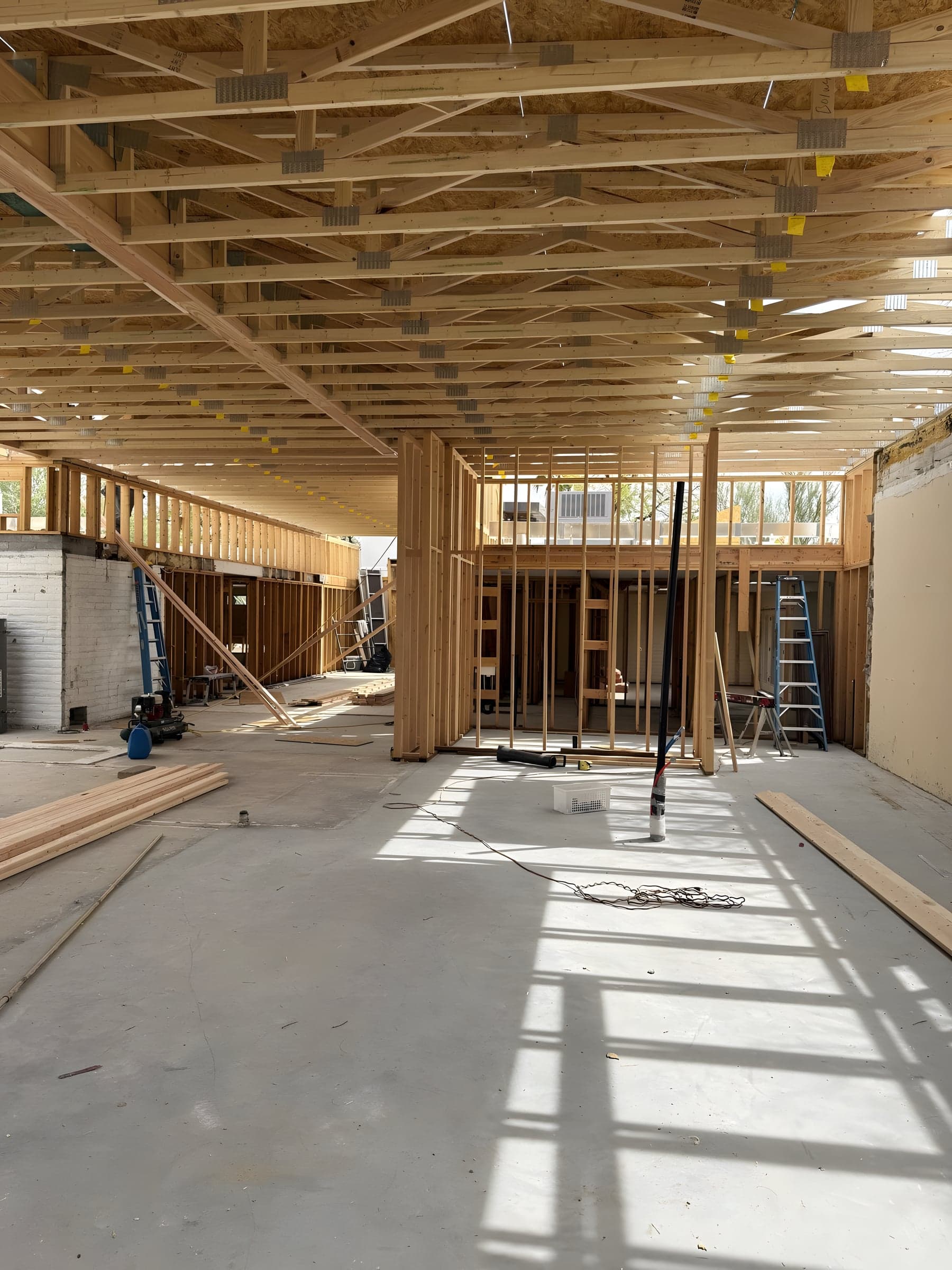 Interior wood studs framing rooms and hallways