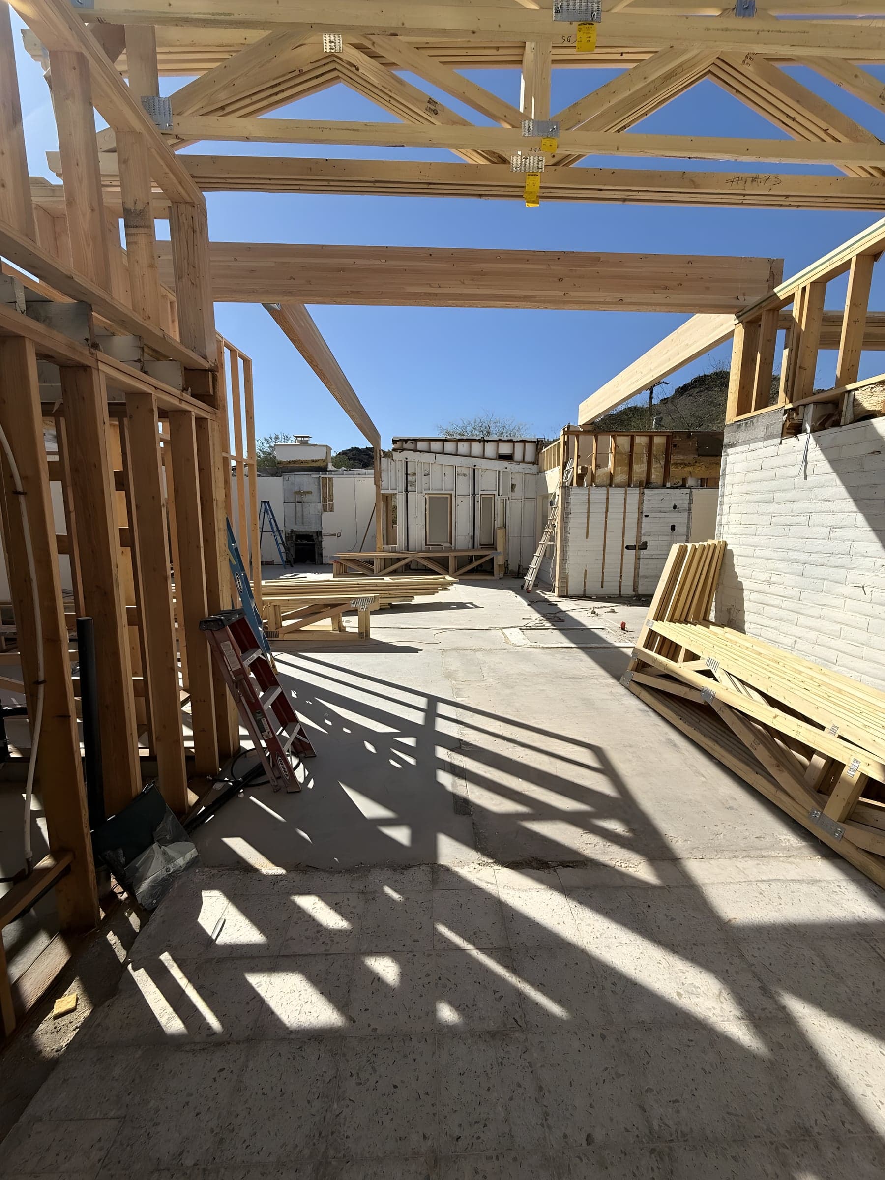 Engineered roof trusses installed on top of framing
