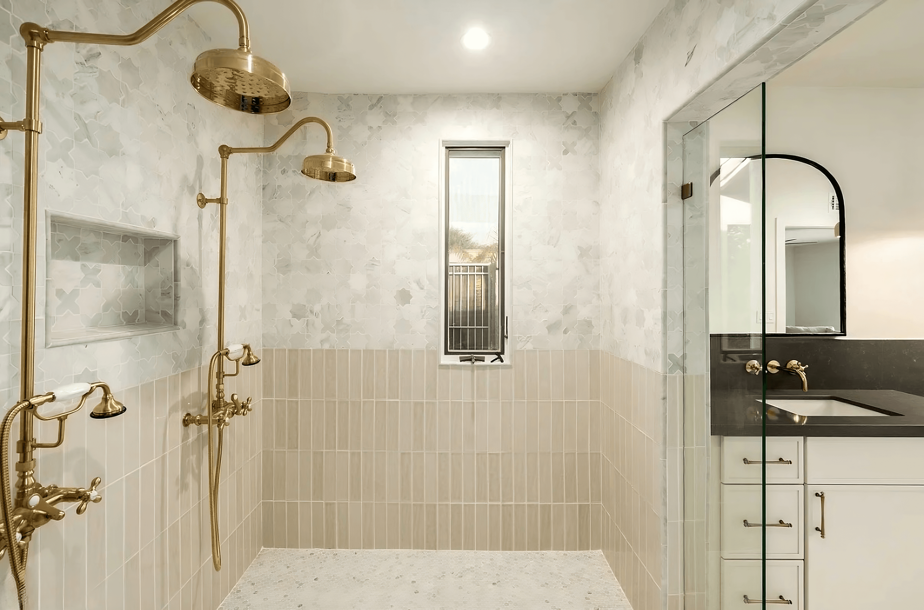 Luxury dual rain shower with brass fixtures in a Paradise Valley remodel
